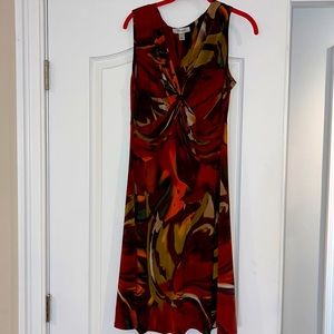 Brown, orange and green dress with v neck.  Gathered and touched at the chest.